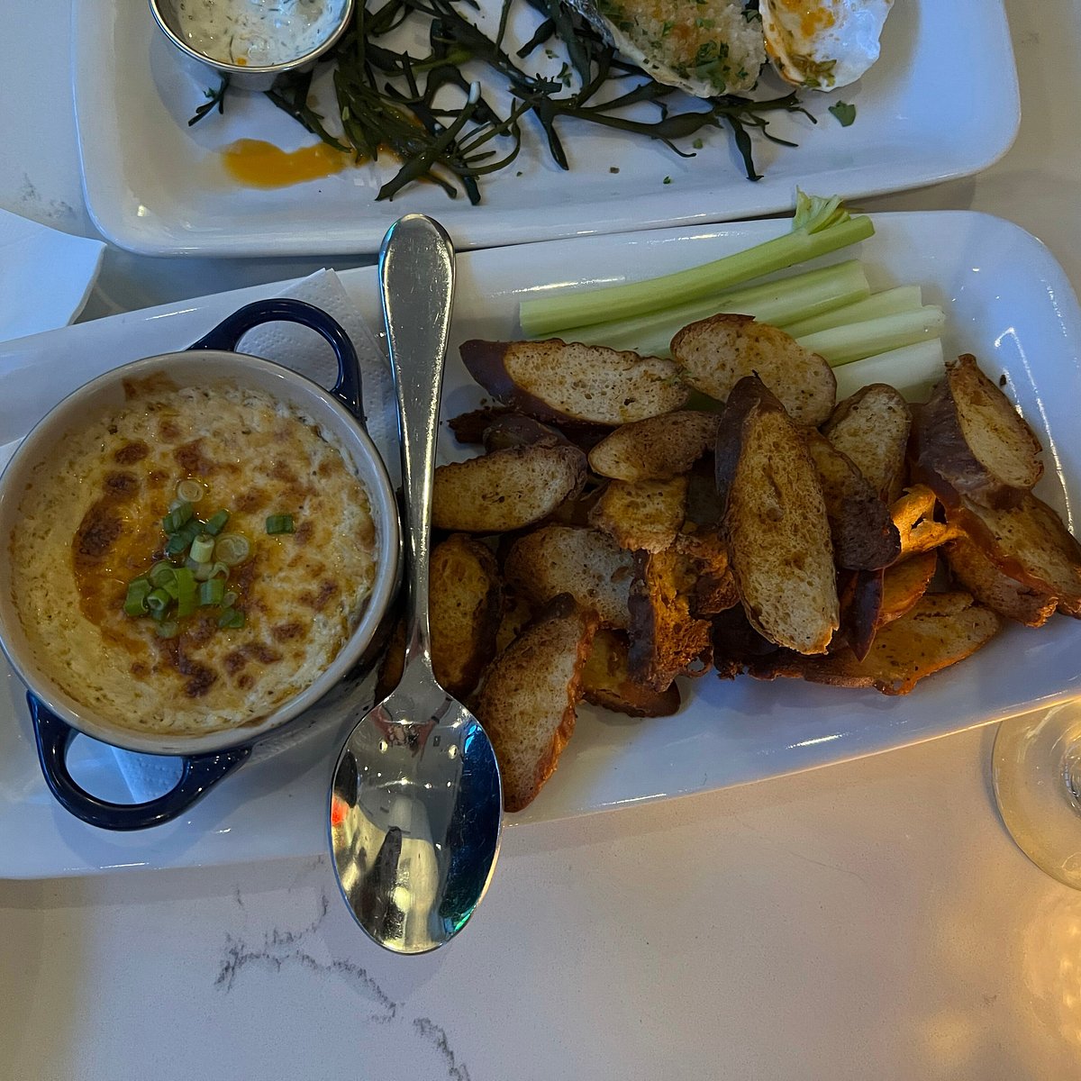 Olive and Oak signature dishes O+O BurgerBlue Crab GratinButterscotch Pudding